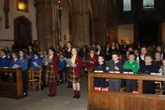 Choral Scholars sing carols with more than 700 primary school pupils